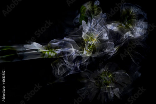 Abstract backdrop with stains of multicolor incense smoke
