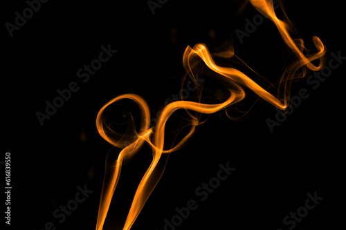 Abstract backdrop with stains of yellow incense smoke