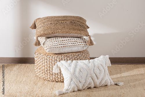 decorative pillows and cushions, basket and blanket with tassels on white background