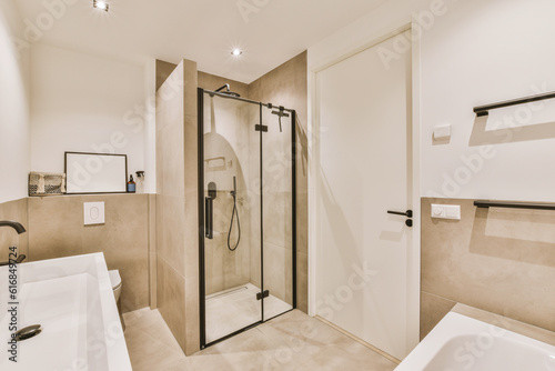 a modern bathroom with white walls and beige flooring  along with a walk - in shower next to the bathtub