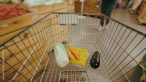 Filling the trolley with groceries in the supermarket, timelapse.
