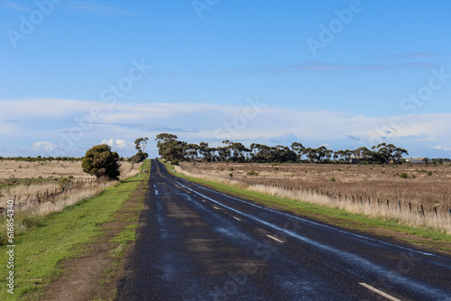 country road through australian rural landscape