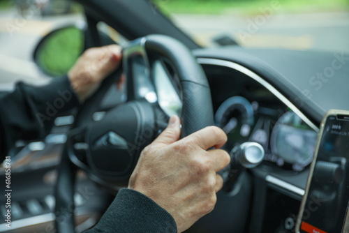 car hand wheel, symbolizing control, navigation, and the driver's connection to the road. Represents power, freedom, and the journey ahead © Your Hand Please