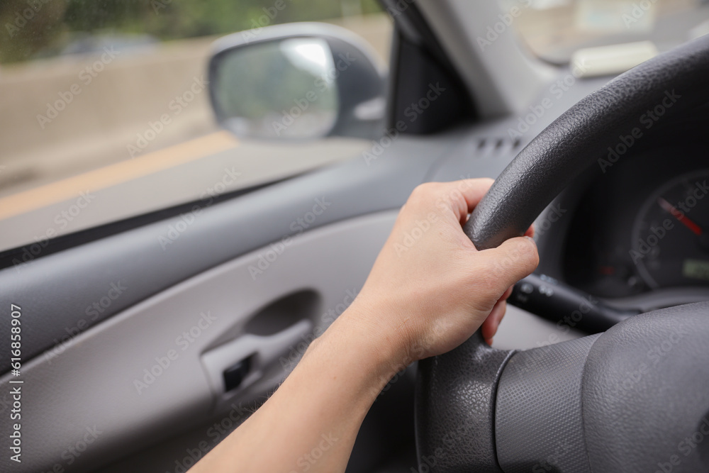 car hand wheel, symbolizing control, navigation, and the driver's connection to the road. Represents power, freedom, and the journey ahead