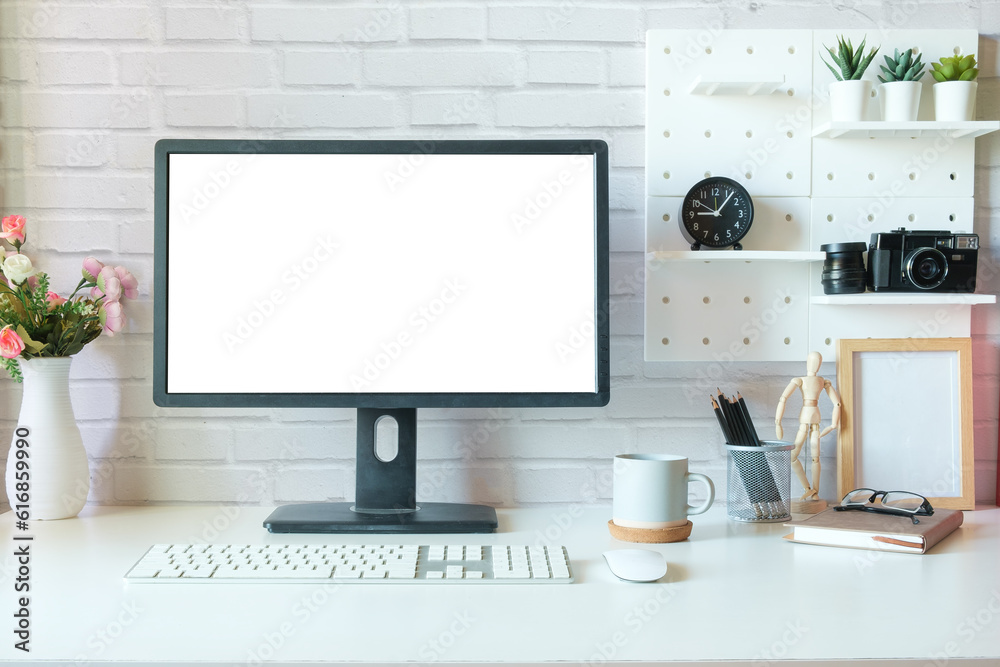 Blank computer monitor and office supplies on white table in modern workplace. Blank computer monitor and office supplies on white table in modern workplace.