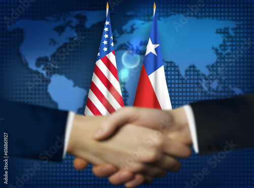 Two person shaking hands in front American,Chile flags.Chile,US bilateral relation concept background
