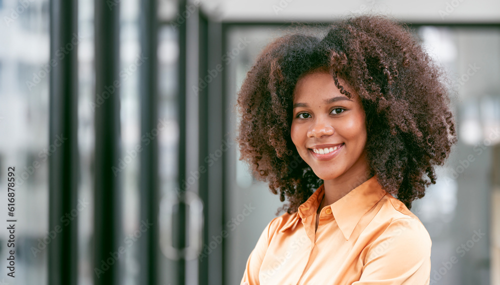 Fototapeta premium Portrait confident young businesswoman standing in office