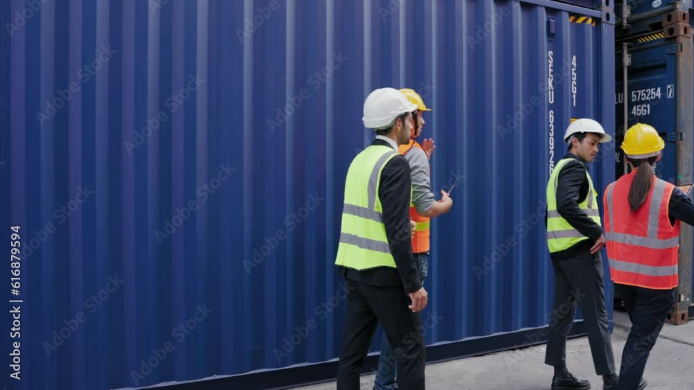 A group of employees walk and talk to executives who come to inspect the goods in the container, Business cargo shipping import and export logistic concept A group of employees walk and talk to executives who come to inspect the goods in the container, Business cargo shipping import and export logistic concept