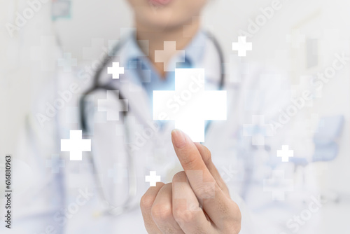 Healthcare and medical background. Doctor, surgeon, holding medical cross symbol. Concept of health care and insurance