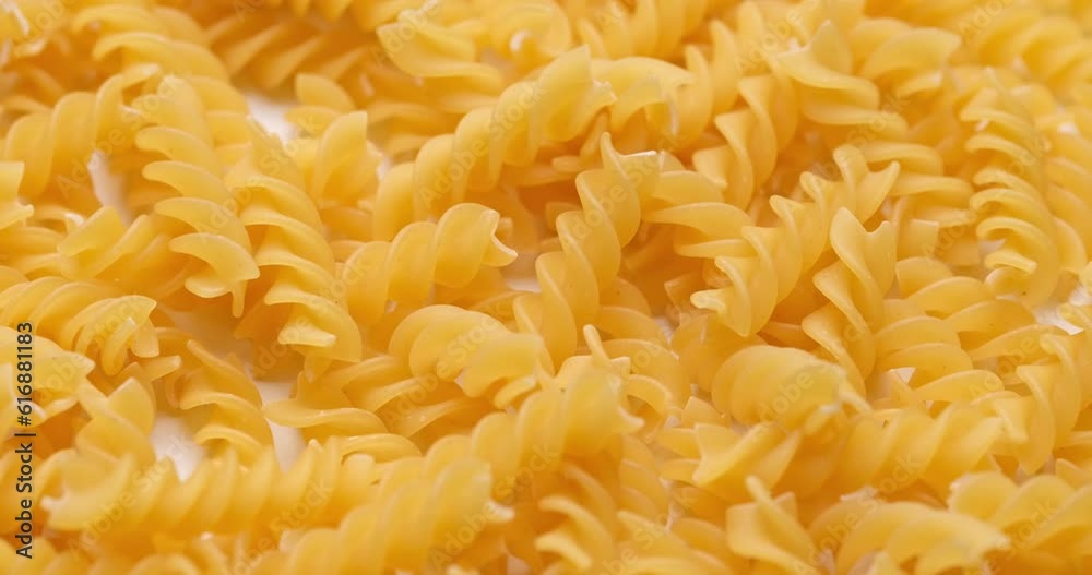 pasta backgroud - macro view of Dry Authentic Italian fusilli pasta backgroud - macro view of Dry Authentic Italian fusilli