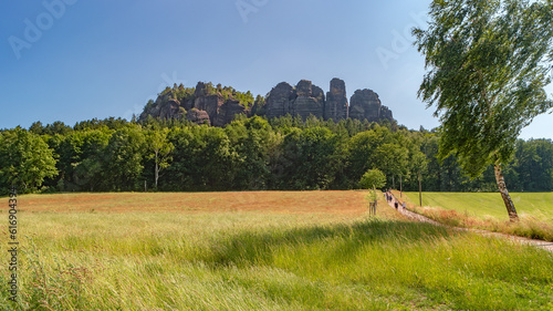 Königstein, Saxony, Germany. View the mount Pfaffenstein  and its sandstone rockss in the national park Saxon Switzerland by Elbe river and green countryside fields and forests photo