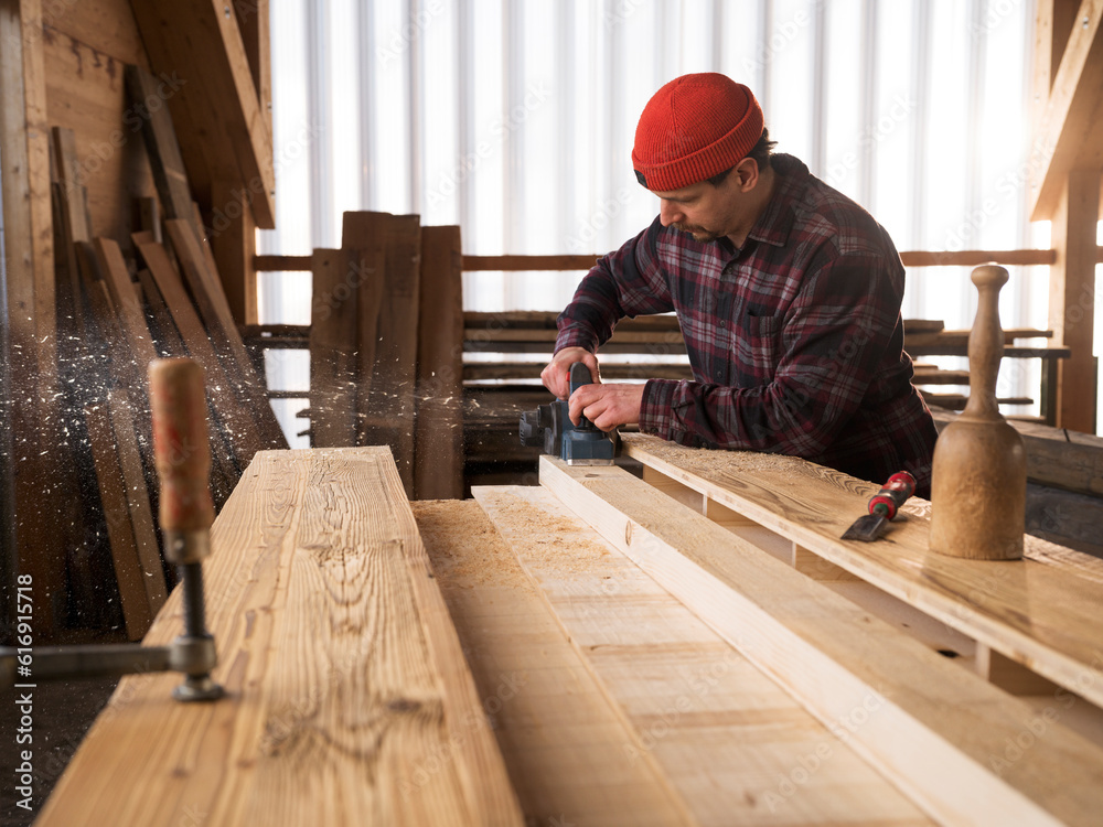 Carpenter working with hand tool at workshop Carpenter working with hand tool at workshop