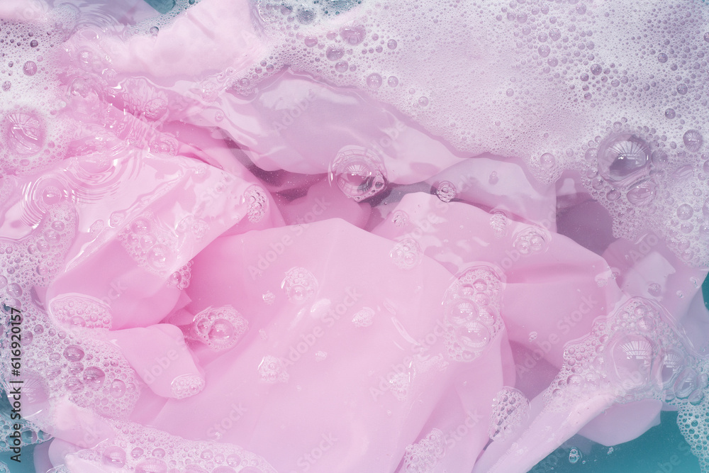 Clothes soak in powder detergent water dissolution, washing colored clothes Clothes soak in powder detergent water dissolution, washing colored clothes