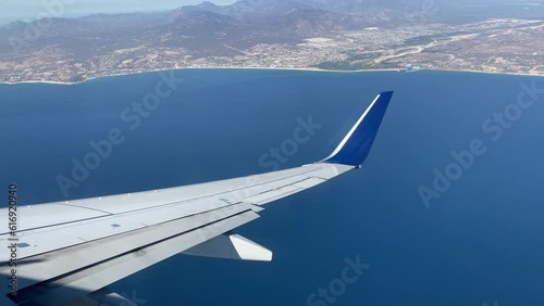 Commercial aircraft flying over the Gulf of California that separates the Gulf of California from the Pacific Ocean in southern Mexico, heading towards Cape Saint Luke International Airport.