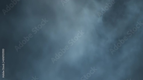 The cinematic atmosphere of smoke being hit with white strobing light. Layered VFX atmospheric violent strobe light clip. The 4K slow-motion atmosphere clip with moving flickering light. photo