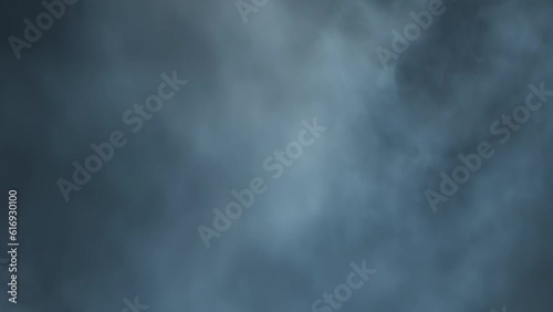 The cinematic atmosphere of smoke being hit with white strobing light. Layered VFX atmospheric violent strobe light clip. The 4K slow-motion atmosphere clip with moving flickering light.