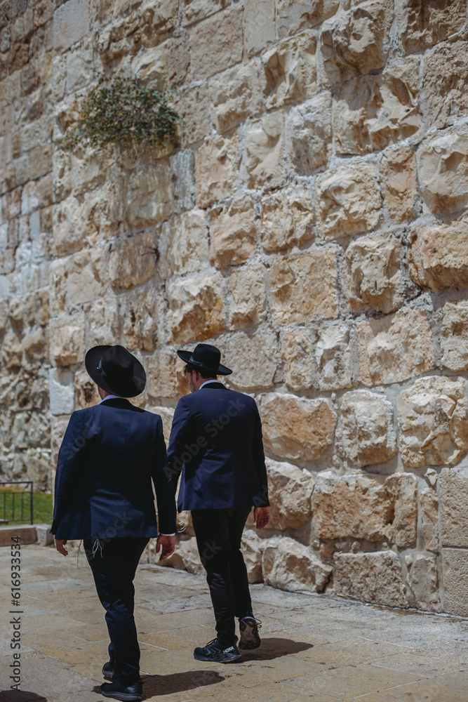 city old town Jerysalem. Jewish men in black suits