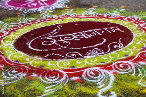 Colourful Rangoli Design is an art form made during using powder colours during Diwali, Onam, Pongal, Hindu festivals in India. photo