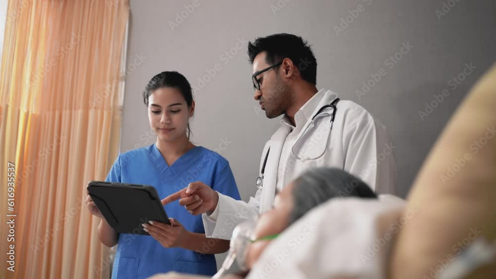 Doctors and nurses check patient outcomes in the recovery room after treatment. Doctors and nurses check patient outcomes in the recovery room after treatment.