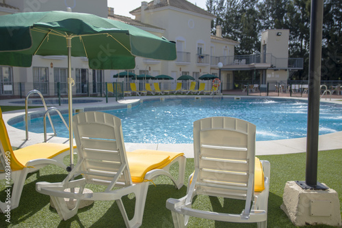 Chairs near swimming pool in residence