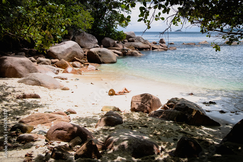 Young woman in bikini on the beach of Seychelles 