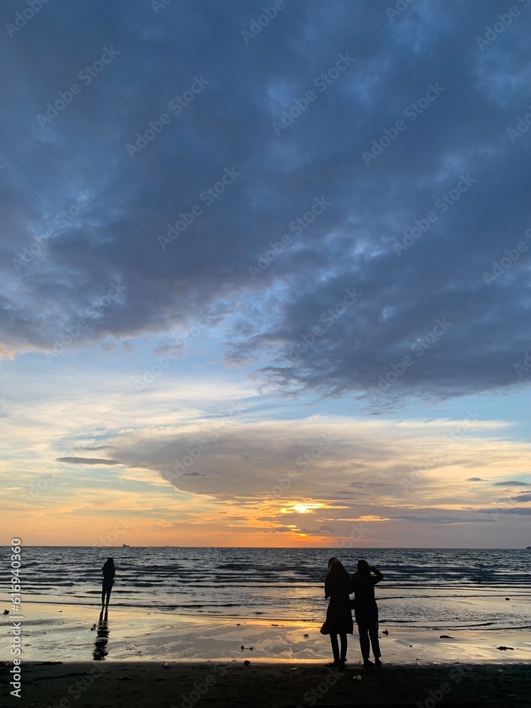 silhouette of a couple on the beach