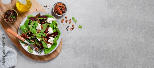 Fresh Salad with Beetroot, Feta Cheese, and Pecans, Healthy Vegetarian Meal on Grey Background