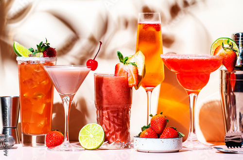 Strawberry cocktails set. Mocktails, smoothies and shakes with fruits and berries in glasses. Refreshing cold drinks and beverages. Beige pink background, hard light, shadow pattern