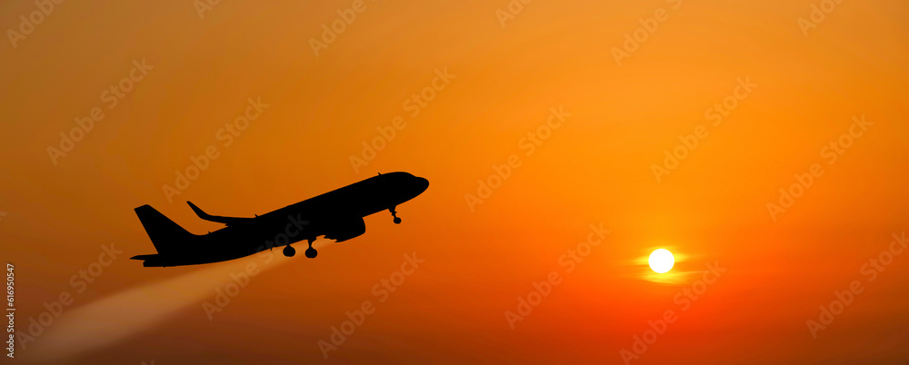 The plane takes off at sunset.