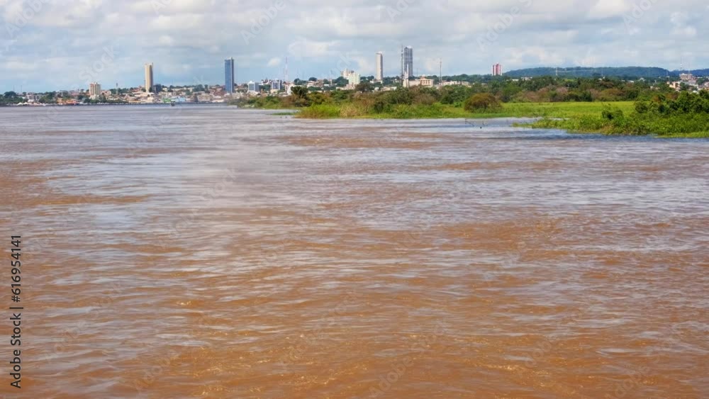 view of Santarem city skyline from boat sailing amazon river in Brazil 