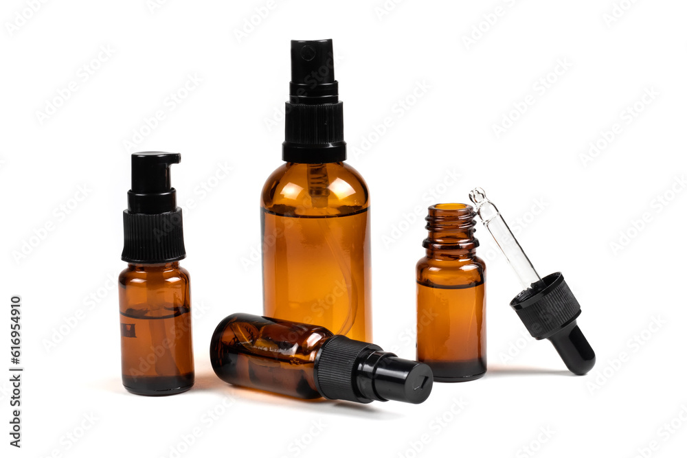 Cosmetic bottles with pipette on white background Cosmetic bottles with pipette on white background