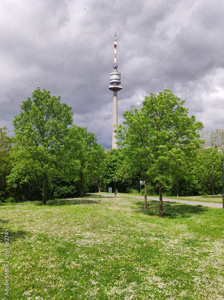Obraz premium view of the Danube Tower in Vienna with cloudy sky in the background