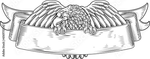 An eagle scroll symbol crest banner parchment design emblem in a vintage woodcut style