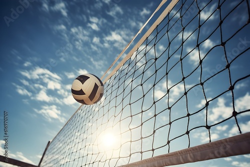A volleyball ball with a net on a clear sky background photo