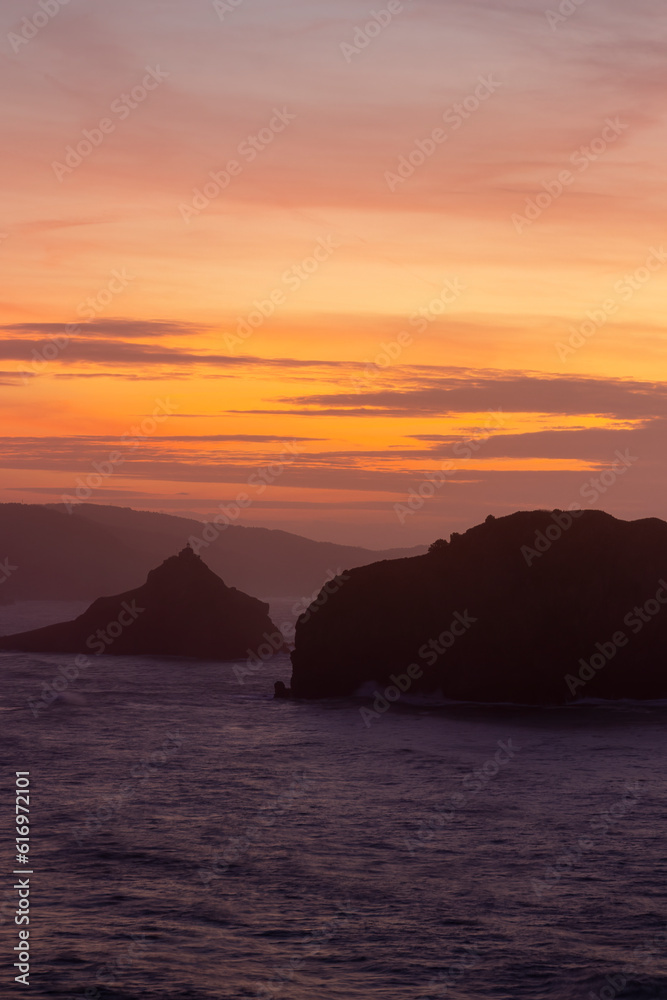 Enchanting Sunset at San Juan de Gaztelugatxe: A Majestic Coastal Haven bathed in Twilight