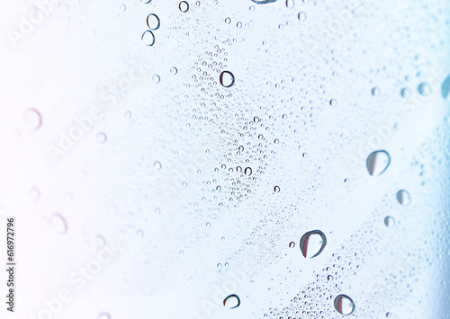 Abstract background with water drops on glass.
