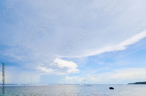 Beautiful seascape. Blue cloudy sky.