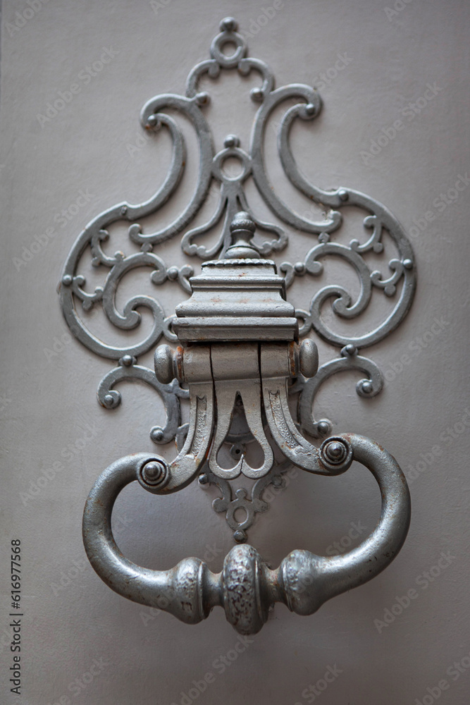 Knocker of a classic French mansion in Bordeaux city Knocker of a classic French mansion in Bordeaux city