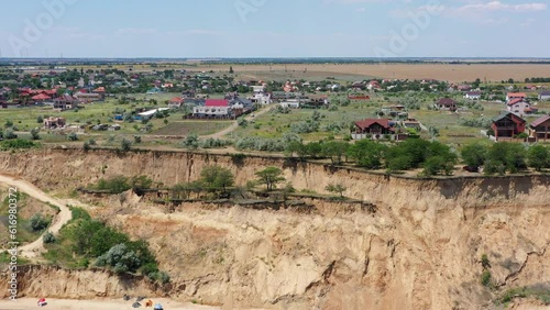 Aerial drone view of Coastline Black Sea near Odessa, Ukraine. Part of the seaside with landslide zone. Ruined shore, beach, danger spot, earthquake. Camera moves sideward