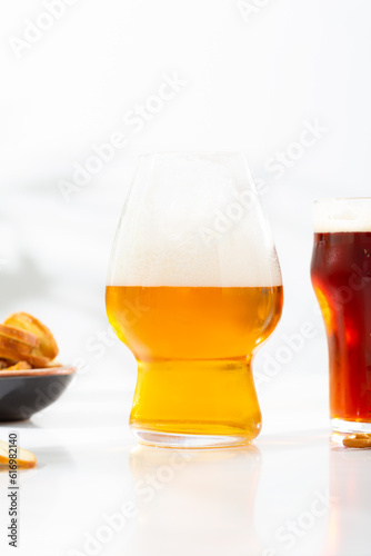 Two glasses with cold beer food and drnk