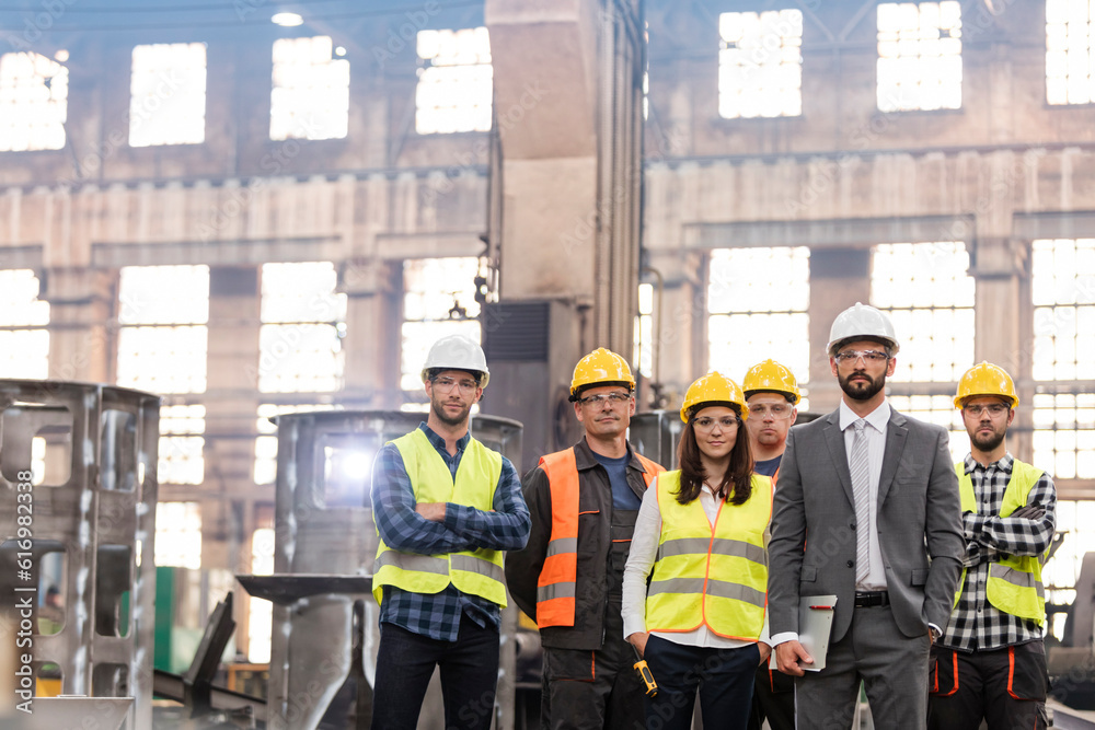 Portrait confident manager and steel worker team in factory - obrazy, fototapety, plakaty 