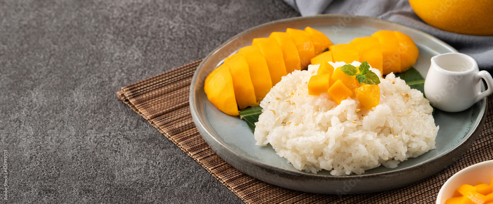 Delicious Thai mango sticky rice with cut fresh mango fruit in a plate. Delicious Thai mango sticky rice with cut fresh mango fruit in a plate.
