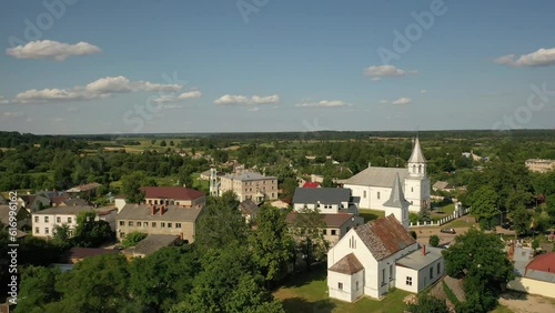 Aerial 4K video from drone to the main square and churches of the city center of Ilukste on a beautiful sunny summer day. Ilukste, Latvia, Selija, Europe photo