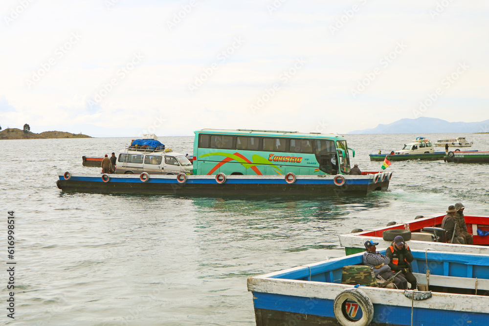 Naklejka premium Vans and Buses on the Ferries Crossing the Strait of Tiquina on Lake Titicaca, Bolivia, South America
