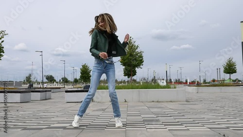 Shuffle dencer. Young beautiful girl dancing modern dance on the street
