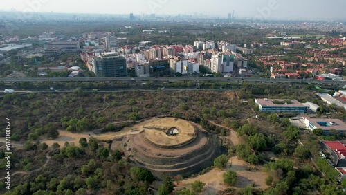 side drone shot of Cuicuilco pyramid at south mexico city photo