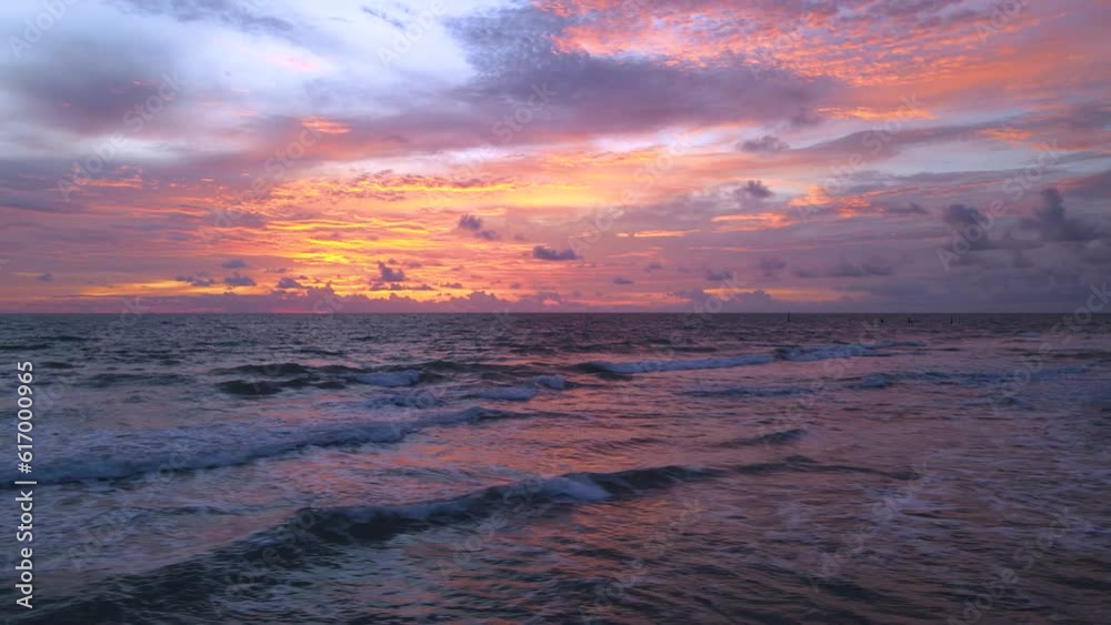 Wave hit beach smooth colorful clouds at sunset evening sky over sea wave Amazing nature video background Stunning clouds and sky in Golden hour Time ,motion move Wave hit beach smooth colorful clouds at sunset evening sky over sea wave Amazing nature video background Stunning clouds and sky in Golden hour Time ,motion move