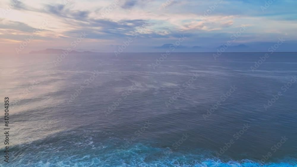 Panning drone clip showing 180 degree view of G-Land, also known as Plengkung Beach, an internationally renowned surf break in Java, Indonesia, at golden sunset Panning drone clip showing 180 degree view of G-Land, also known as Plengkung Beach, an internationally renowned surf break in Java, Indonesia, at golden sunset