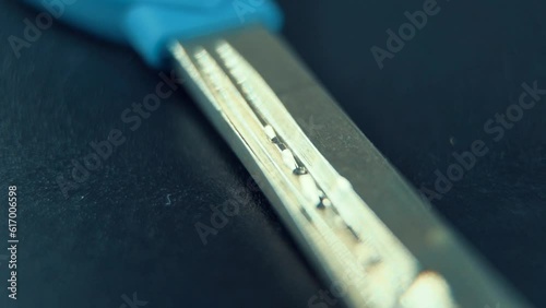 A close up Macro slide shot of a metal house key, studio lighting, slow motion, 120 fps, Full HD photo