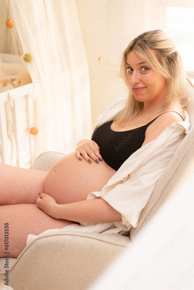 Portrait of a Young pregnant woman in studio lighting